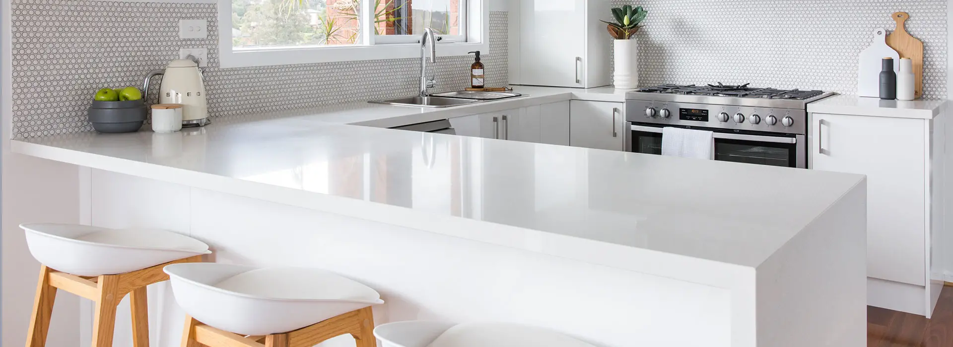 white u shaped gloss kitchen with kitchen stools