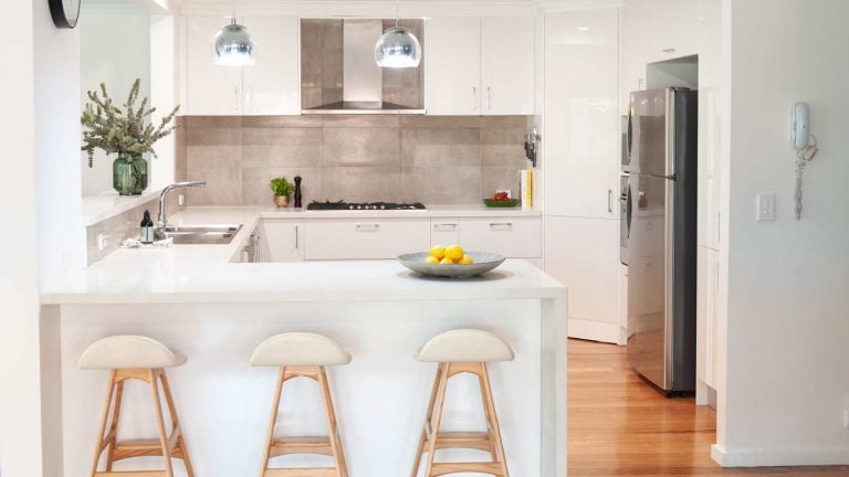 white kitchen with stools