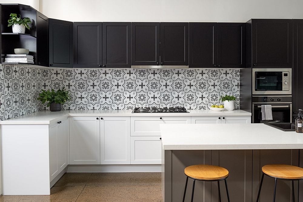 black and white kitchen with patterned tiles