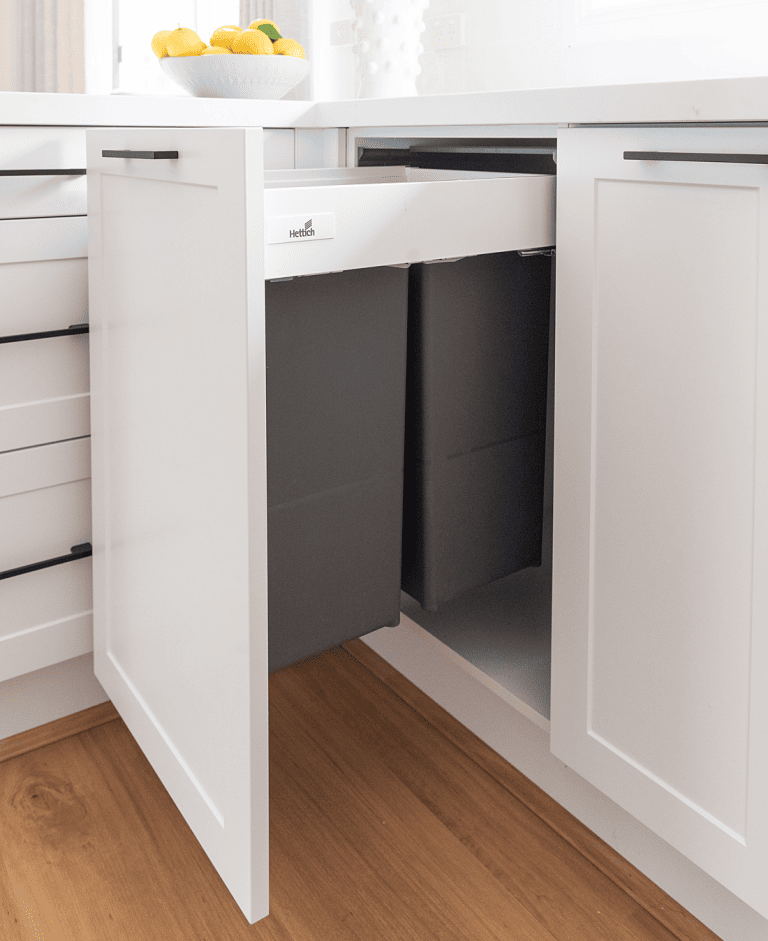 Double large bin system in grey with white cabinetry