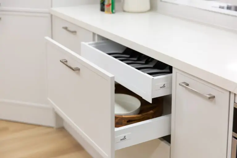 white kitchen cupboards featuring pull out pot drawer and internal cutlery drawere