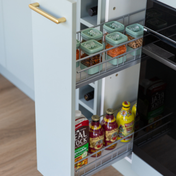 Pull out spice rack featuring containers with spices and sauces