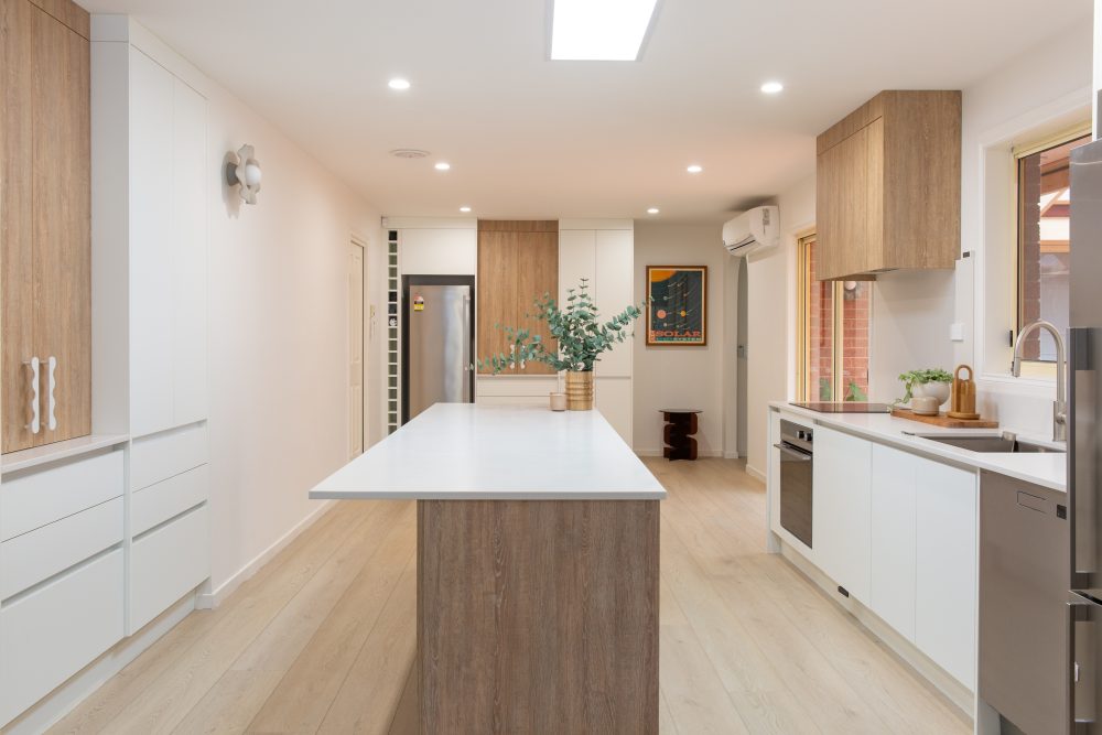 White and timber cabinetry in a galley style kitchen in Seabrook Melbourne