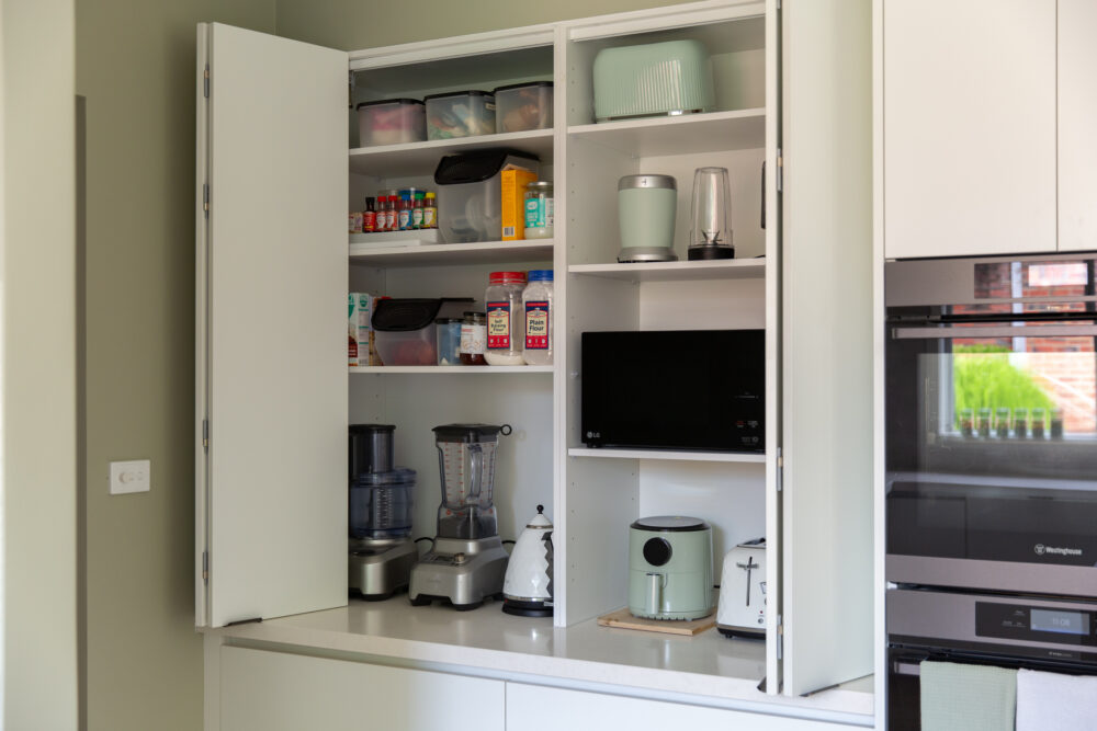 Kitchen displaying an appliance cabinet with underbench cupboards
