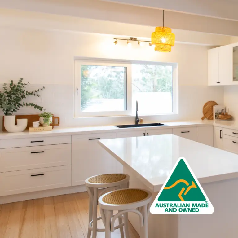 White shaker style kitchen with Australian Made and Owned logo