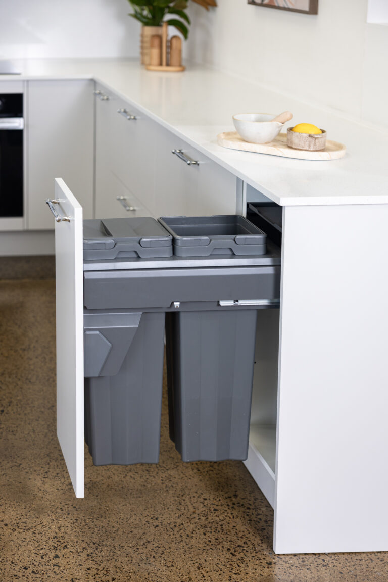 Kitchen drawer in white featuring pull out double bins in dark grey in small size