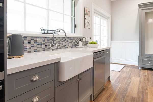 Grey kitchen cabinetry with farmhouse sink