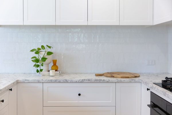 White shaker style kitchen with Durpoal Carrara Marble benchtops