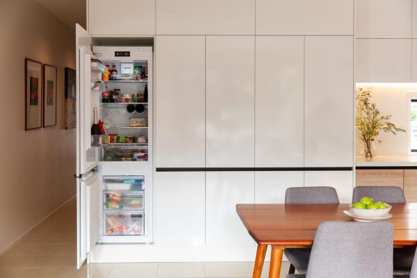 White cabinetry with integrated fridge