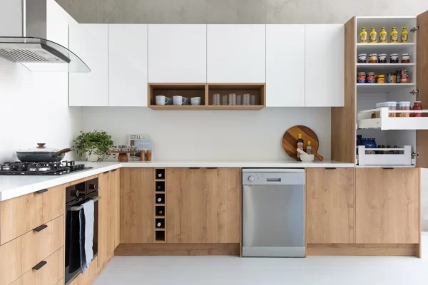 Timber style kitchen cabinetry in u shape with white overhead cabinetry