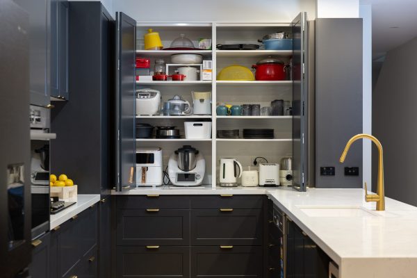 Double appliance cupboards open displaying thermomix and small appliances in a terril shaker style kitchen