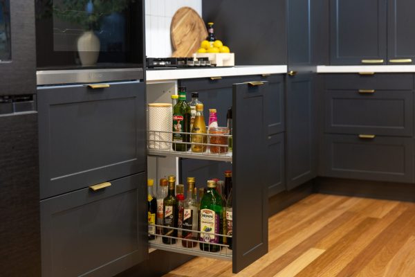 Extra large pull out spice rack with two shelves and spices and sauces on display