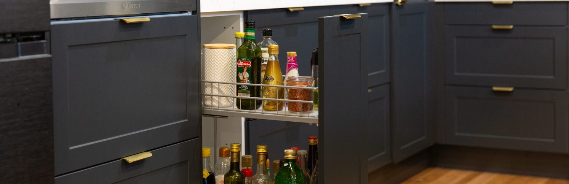 Extra large pull out spice rack with two shelves and spices and sauces on display