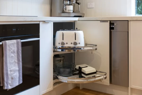 Slide out lazy susan for a corner kitchen solution next to a spice rack
