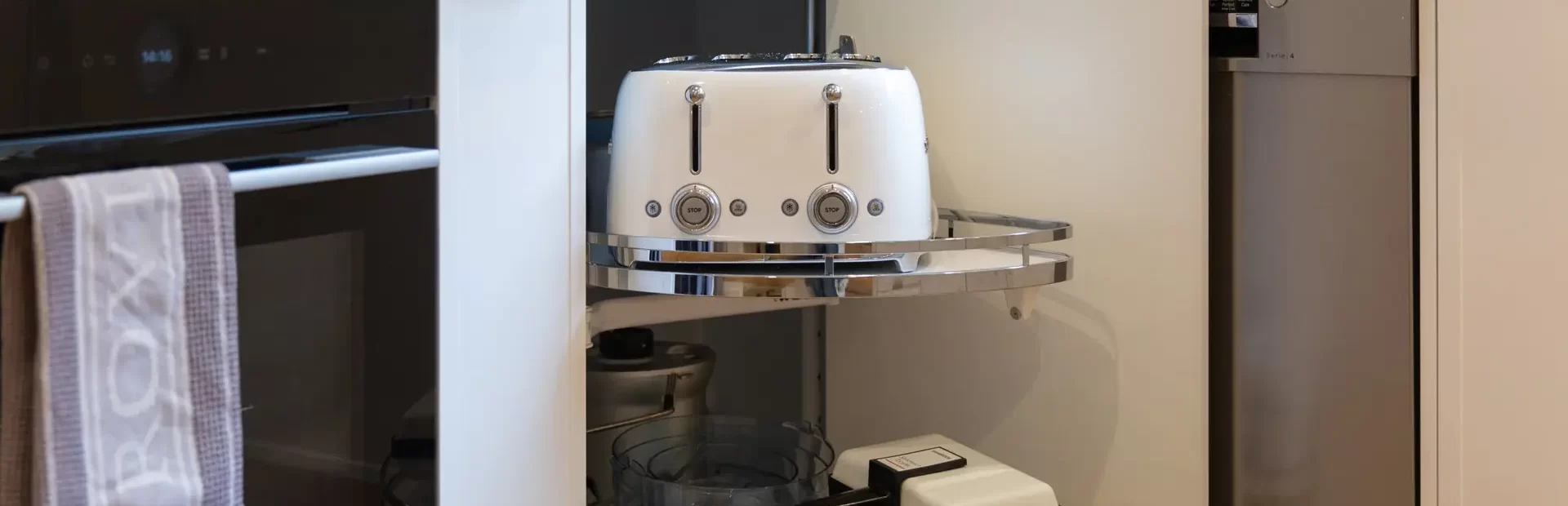 Slide out lazy susan for a corner kitchen solution next to a spice rack