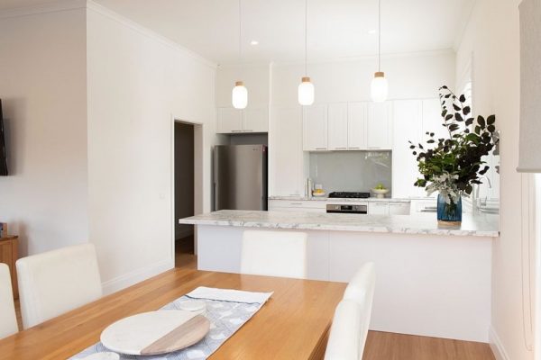 White shaker style kitchen with laminate benchtops
